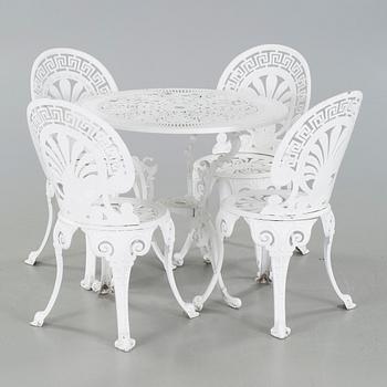 A garden table and four chairs from the latter half of the 20th century.