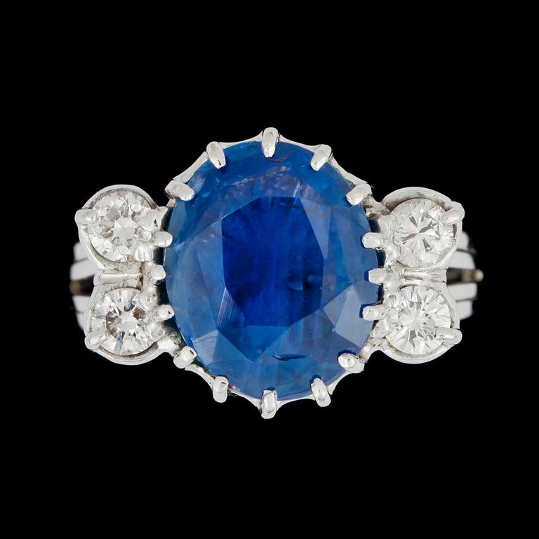 A sapphire and diamond, circa 0.40 ct, ring.