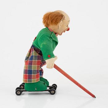 A set of five toys, including 'Rolly' clown from Schuco, 20th century.