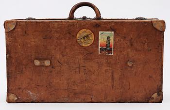 A late 19th cent leather suitcase by Louis Vuitton.