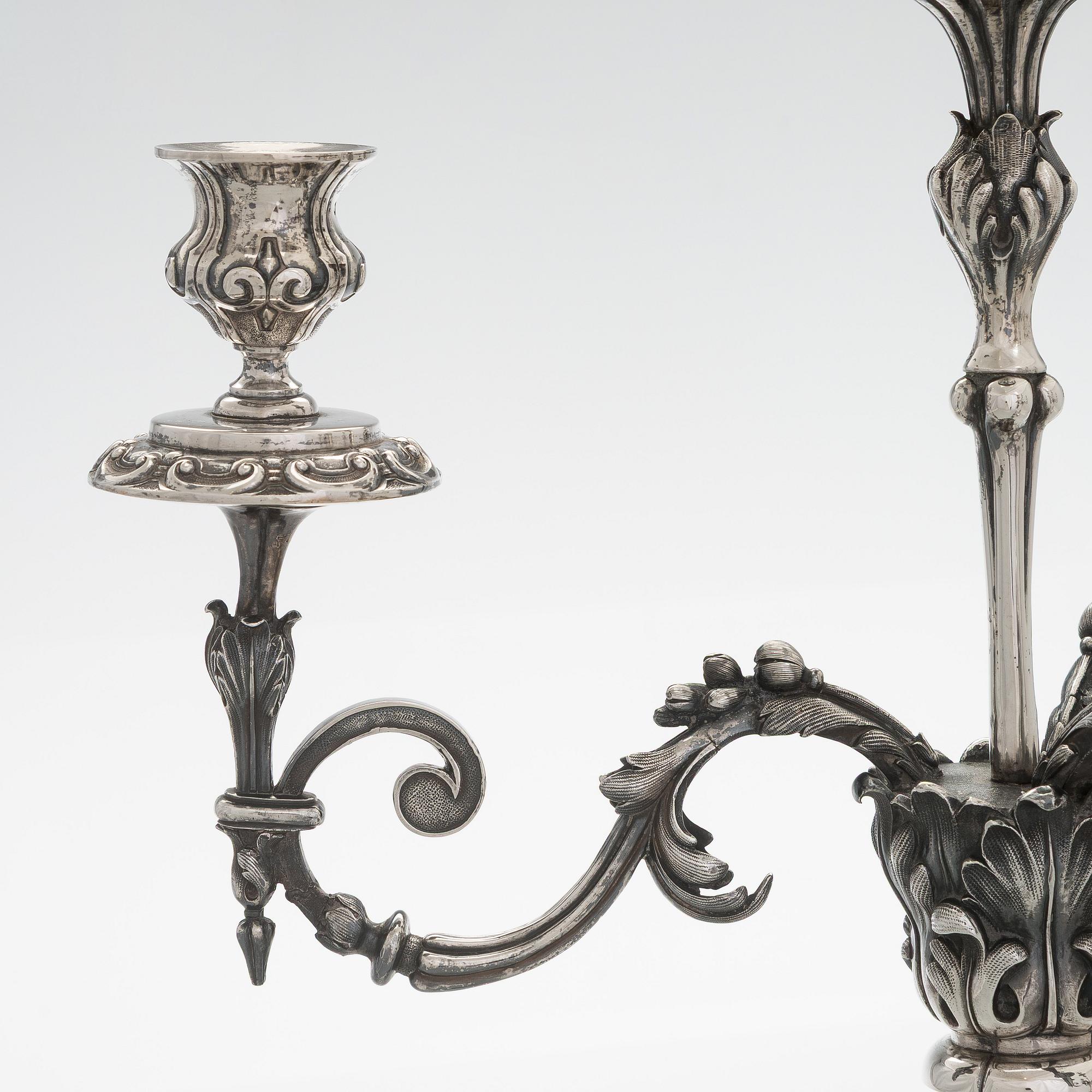 A pair of silver candelabra, maker marks of Carl Johan Tegelsten, Saint Petersburg 1850.