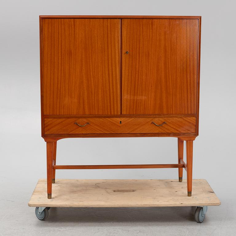 A mahogany veneered cabinet, 1940s/50s.
