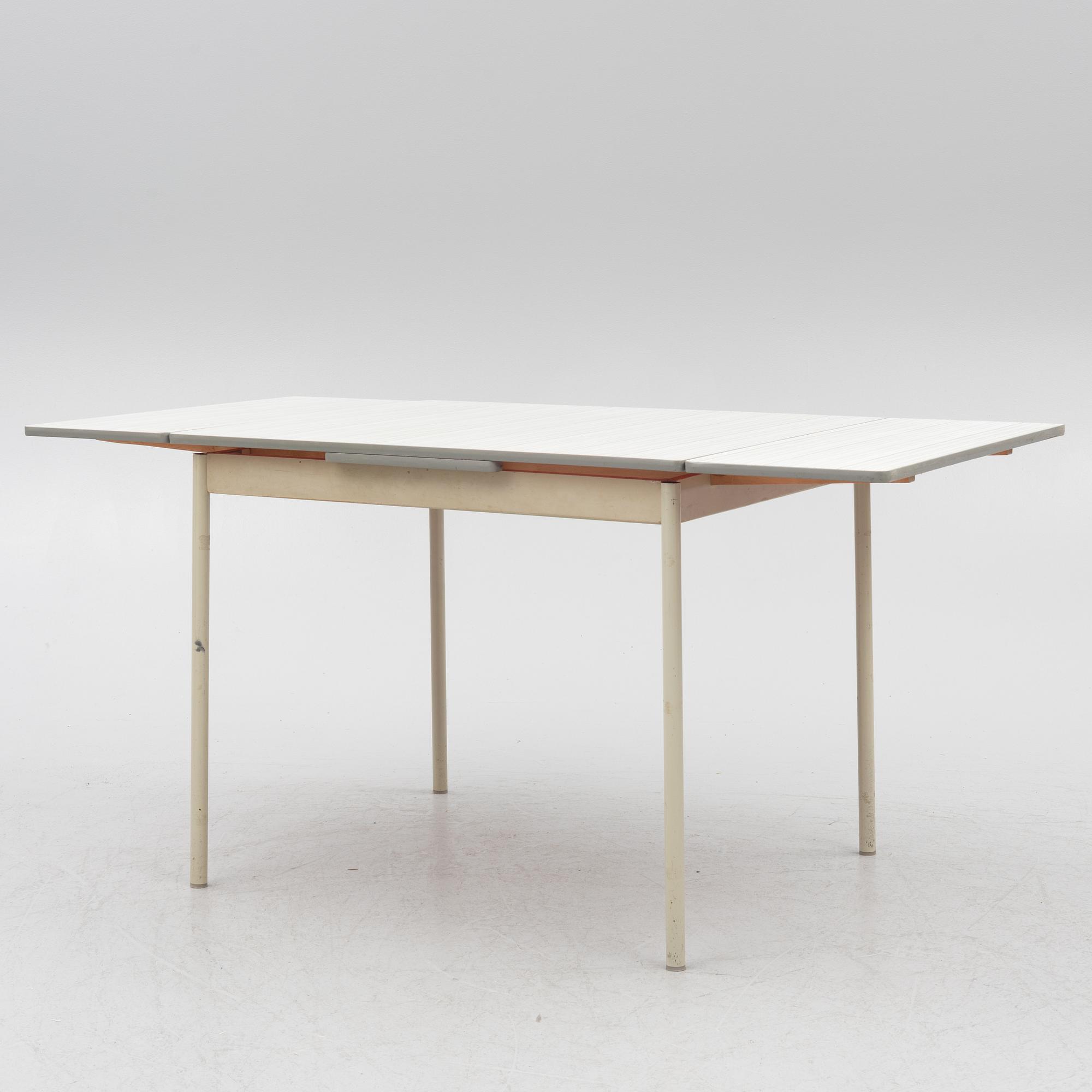 A table and four chairs, mid-20th Century.