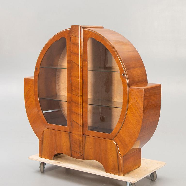 An English 1940s Art Deco walnut display cabinet.