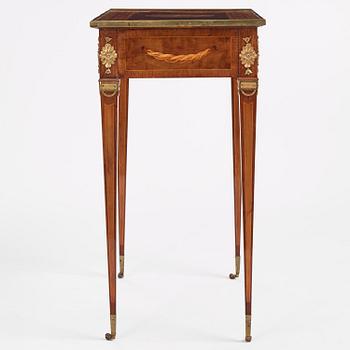 A Gustavian marquetry and gilt brass-mounted table by G. Iwersson (master in Stockholm 1778-1813).