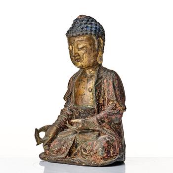 A seated bronze figure of buddha, Ming dynasty (1368-1644).