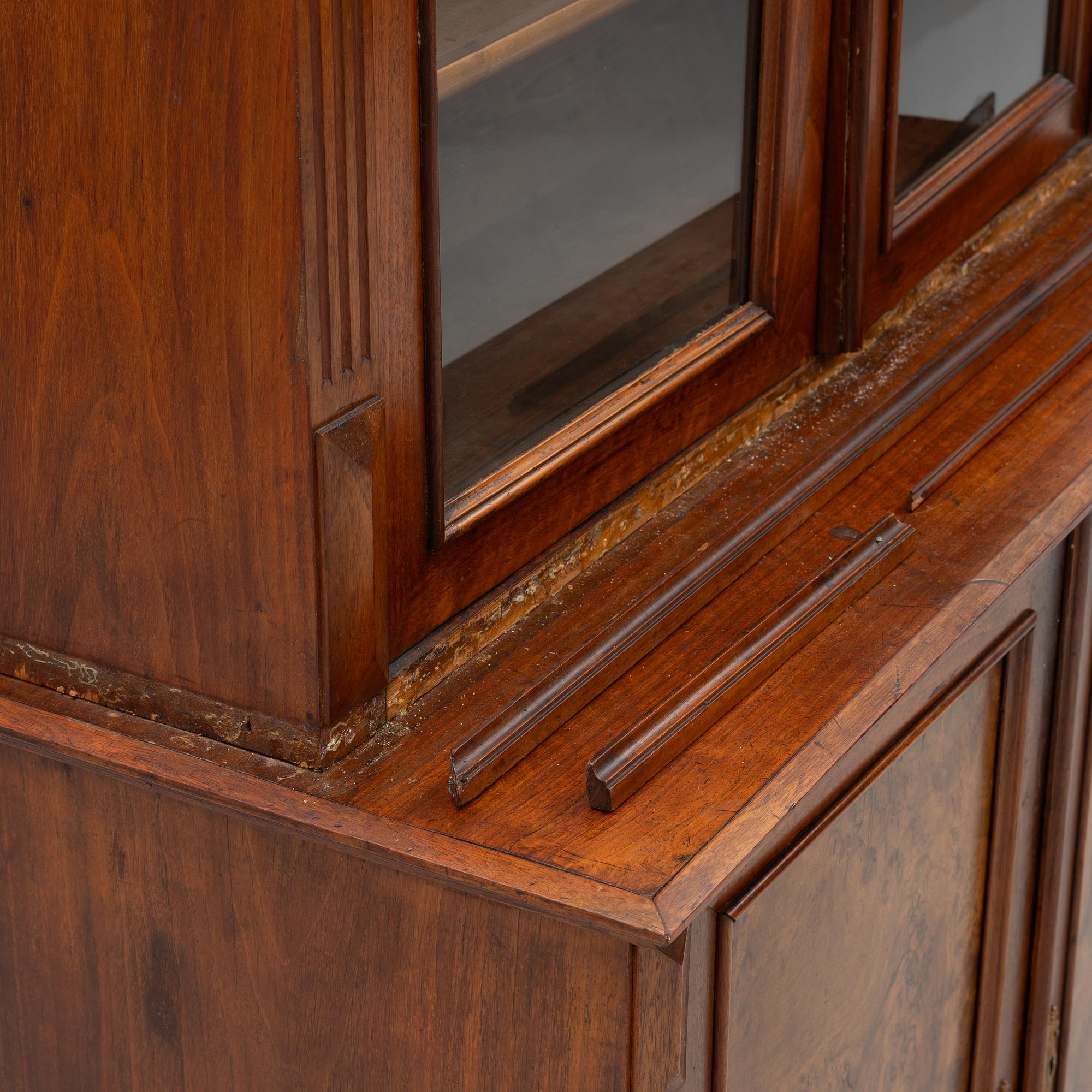 A two part mahogany cabinet, around 1900.
