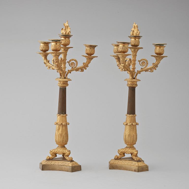 A pair of French Empire early 19th century four-light candelabra.