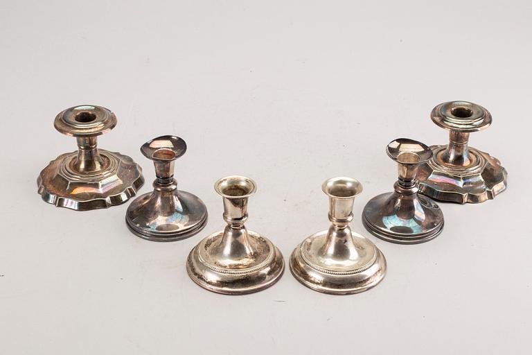 A set of three pair of Swedish 20th century silver candle sticks.