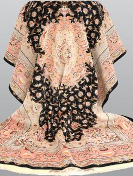 A Tabris carpet, part silk, so called 60 Raj, signed, ca 302 x 199 cm.