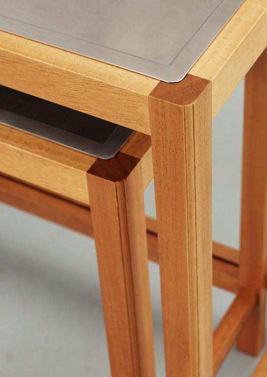 A Josef Frank set of mahogany and stainless steel tables by Svenskt Tenn.