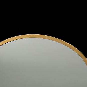 A BRASS WALL MIRROR.