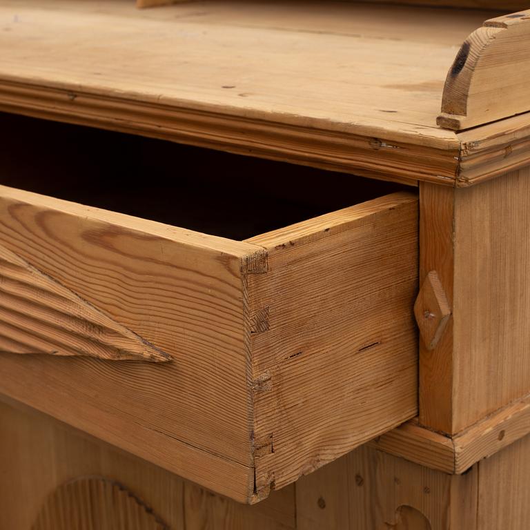 A late gustavian cupboard from the first half of the 19th century.