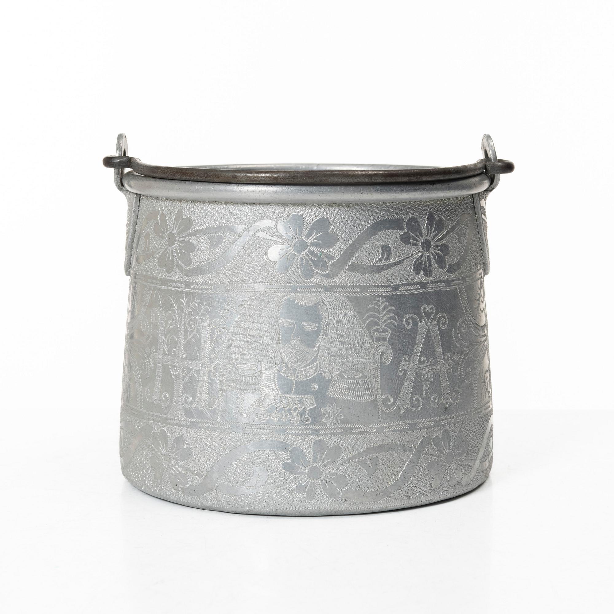 An aluminium bucket, a wooden case, four rings and two miniature knives, Finland and Russia, early 1900s.