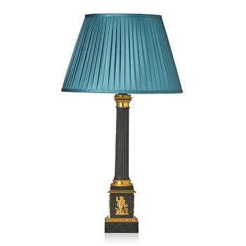 132. A French Empire ormolu and tole lamp, early 19th century.