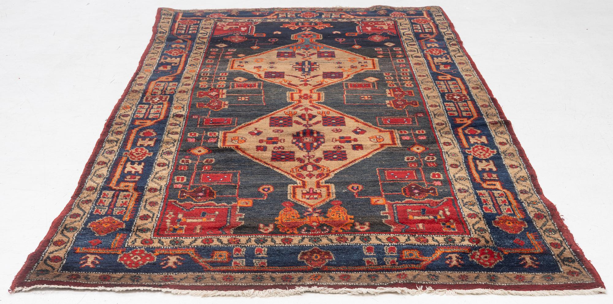 An Oriental rug, c. 282 x 154 cm.