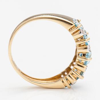 A 14K gold ring with topazes and diamonds ca. 0.04 ct in total.