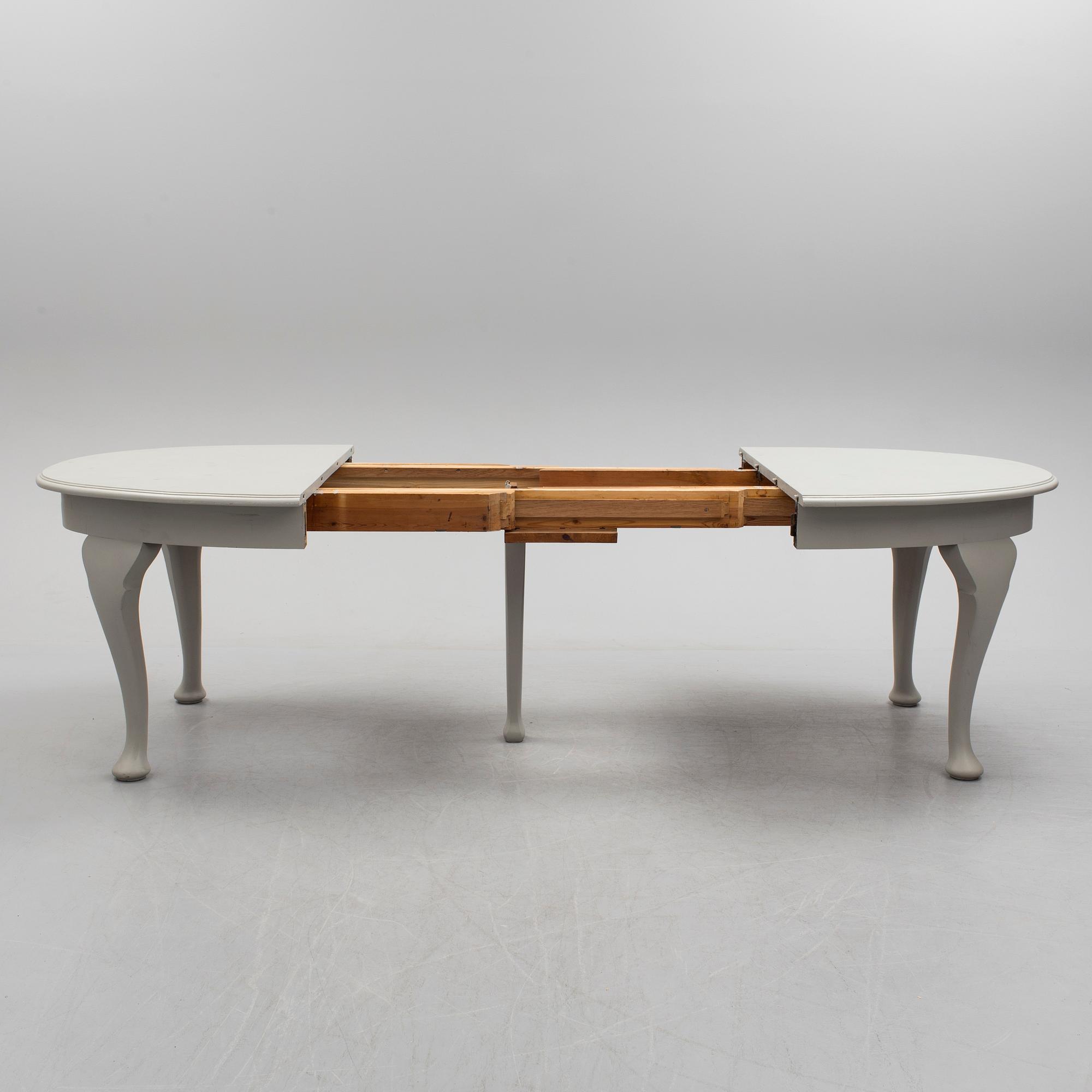 A painted Rococo style dining table, circa 1900.