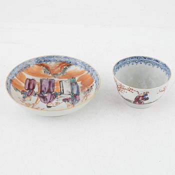 A pair of Famille rose porcelain plates, a cup with saucer and a blue and white charger, China, 18th century.