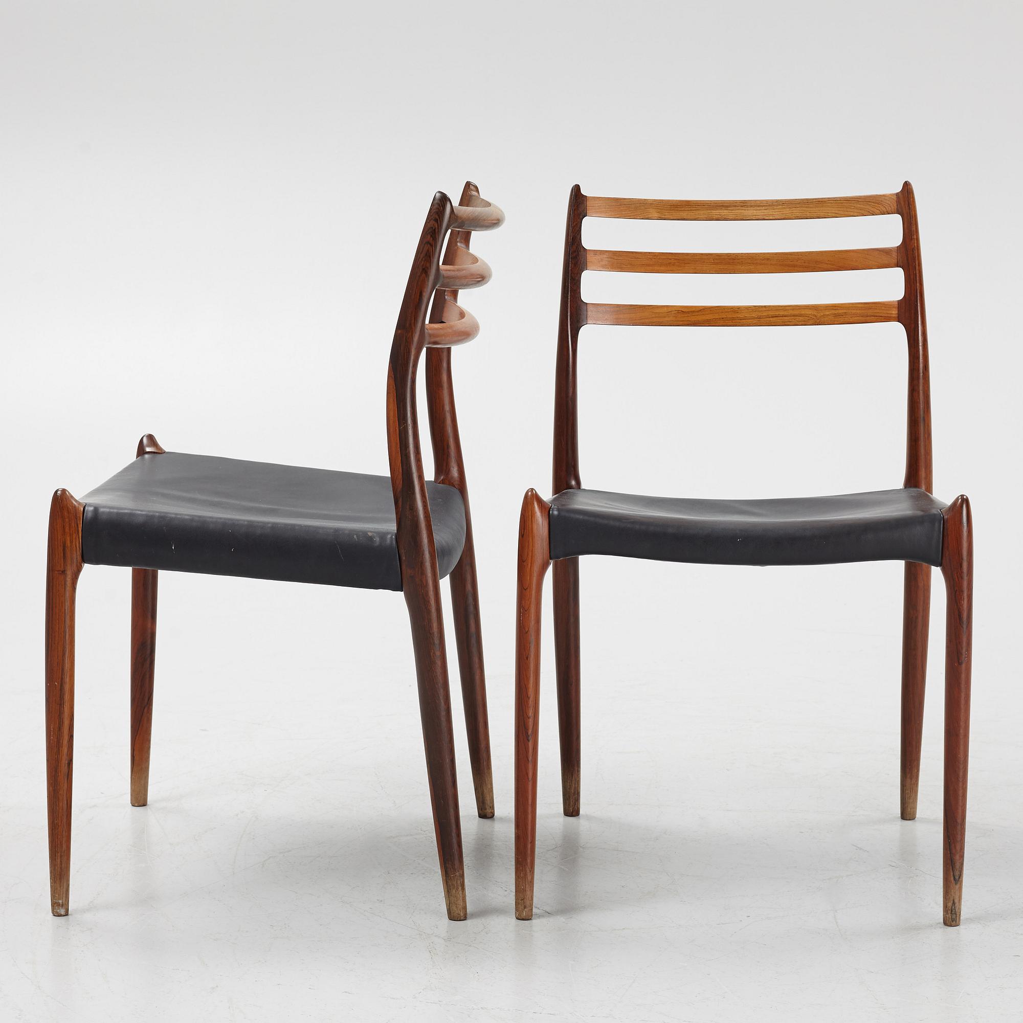 Niles Otto Møller, a rosewood veneered table with four chairs, JL Møller, Denmark, 1950's/60's.