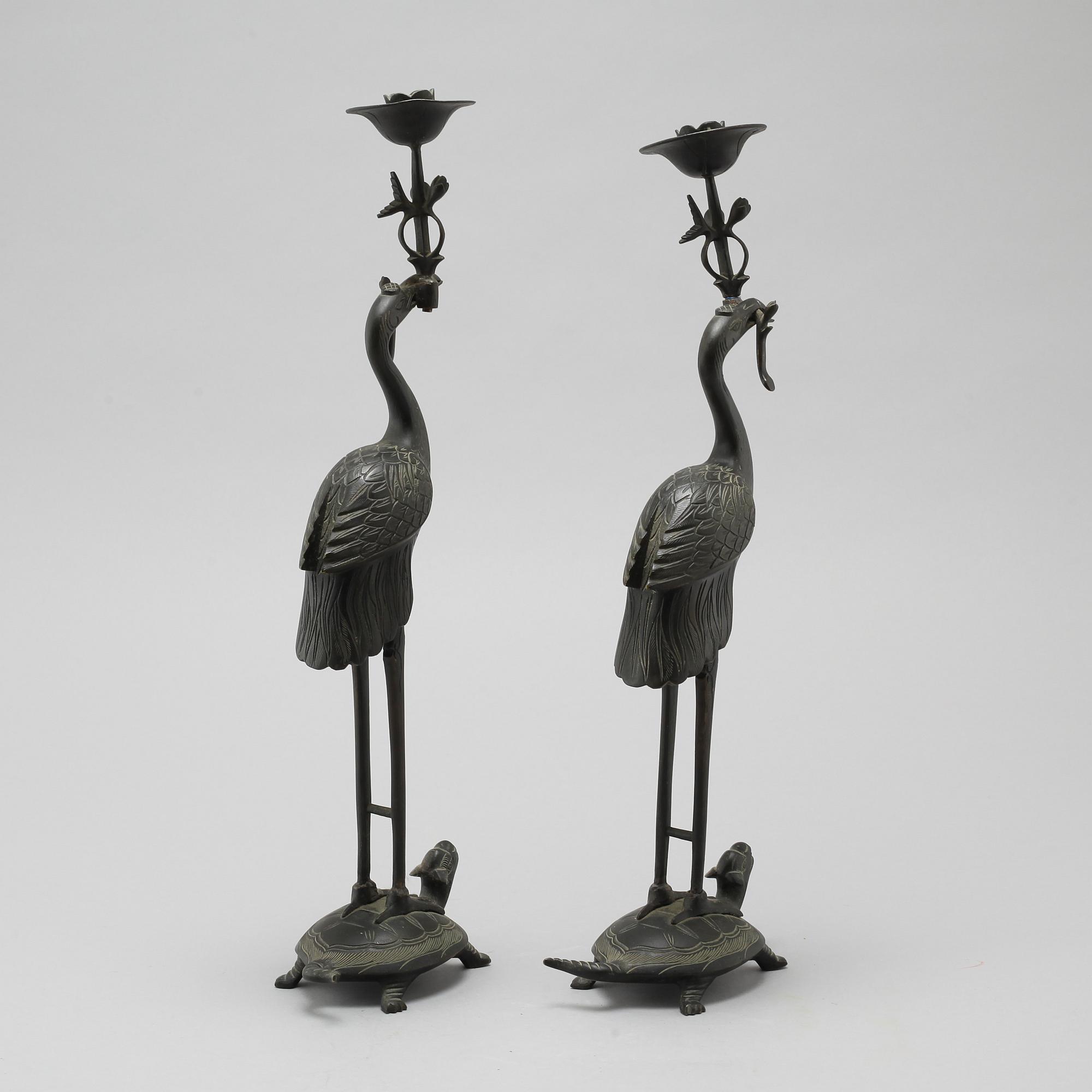 A pair of bronze candlesticks, China, 20th Century.