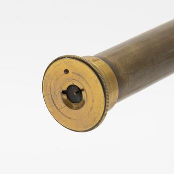 A telescope on a tripod, 19th/20th century.