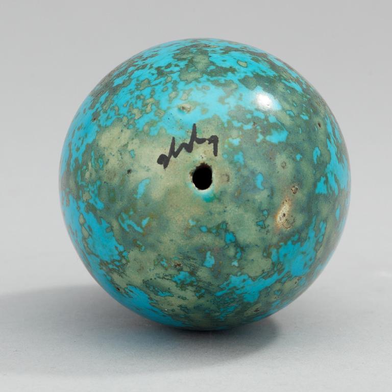 A Hans Hedberg faience egg on an iron base, Biot, France.