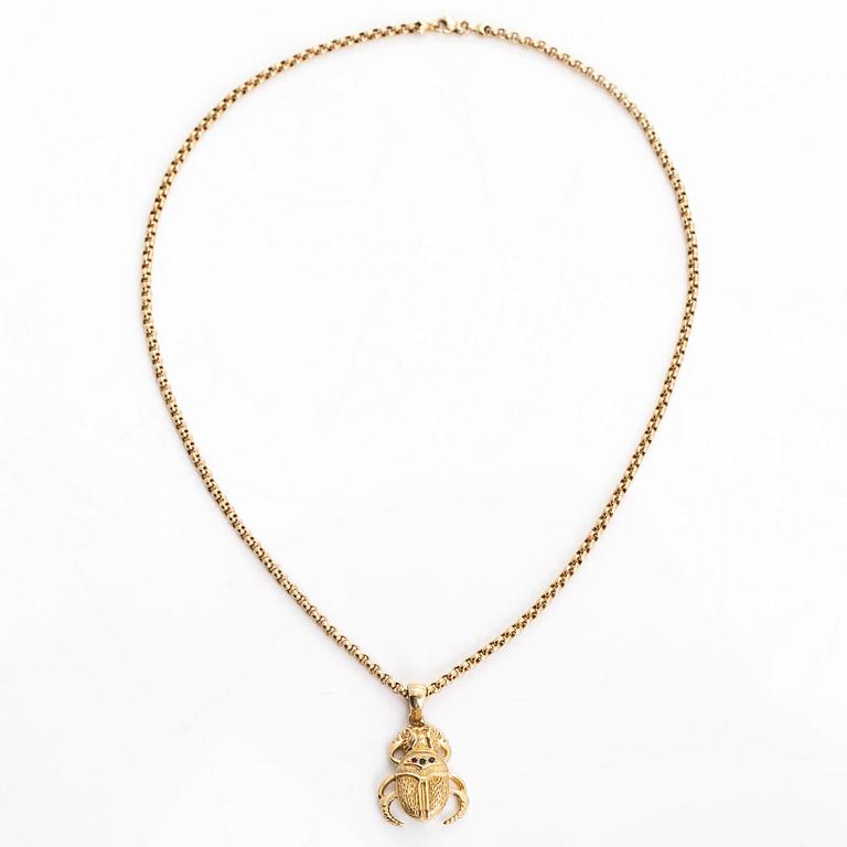 Necklace in 14K gold, with a pendant in the shape of a scarab.