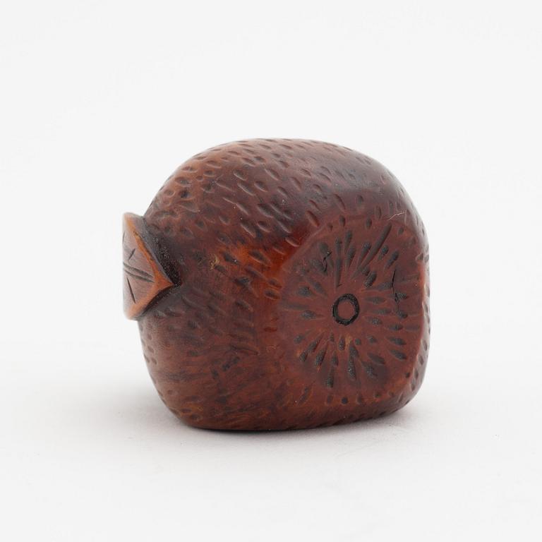 A Japanese carved corozo nut bird feeder, second half of the 19th Century.