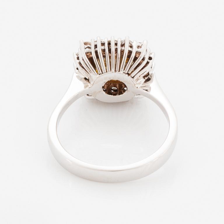 Princess-cut colour treated fancy deep brown-yellow diamond ring.