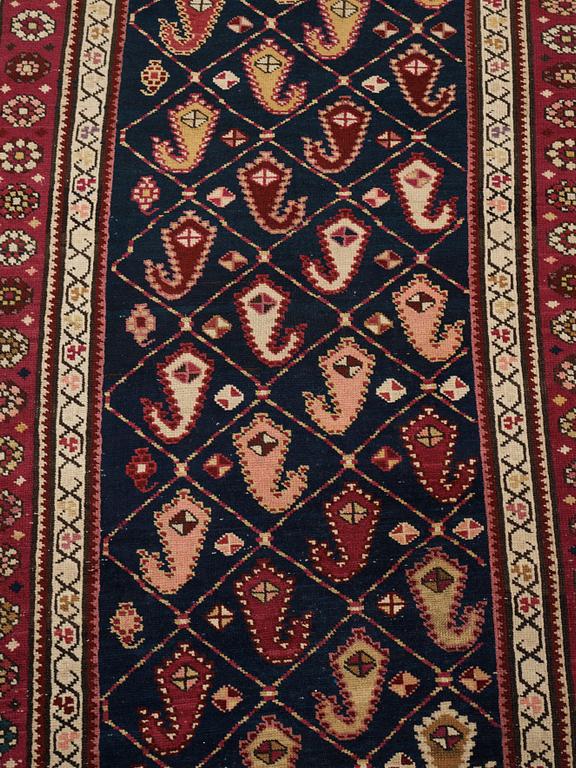 A runner, an antique Karabagh, ca 268,5-278 x 98,5-103,5 cm.