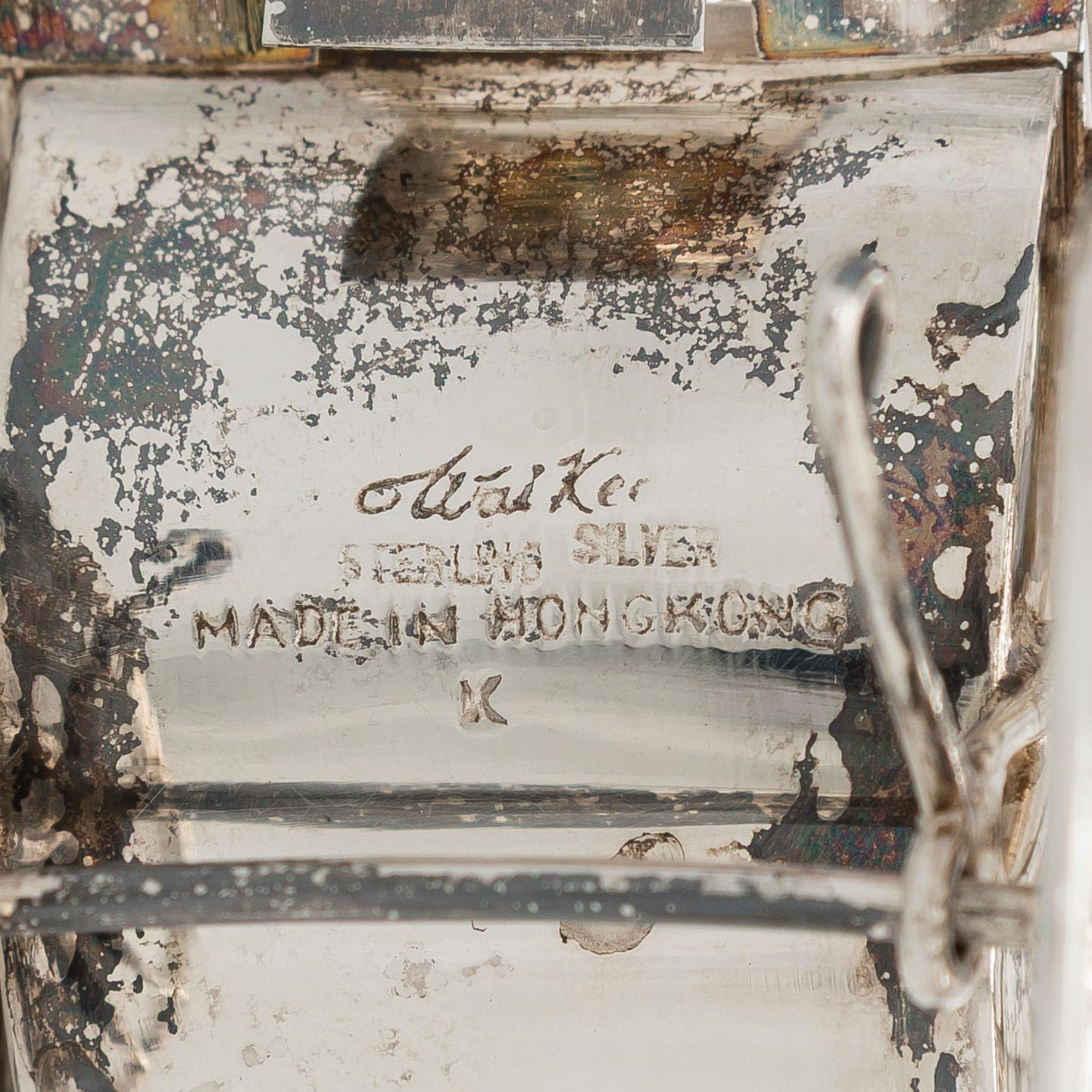 Four shakers in a pair of miniature rickshaws, sterling silver, maker's mark of Wai Kee, Hong Kong.