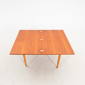 A 1960s oak and teak dining table.