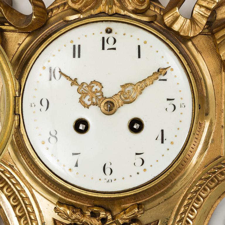 A first half of the 20th century brass wall clock.