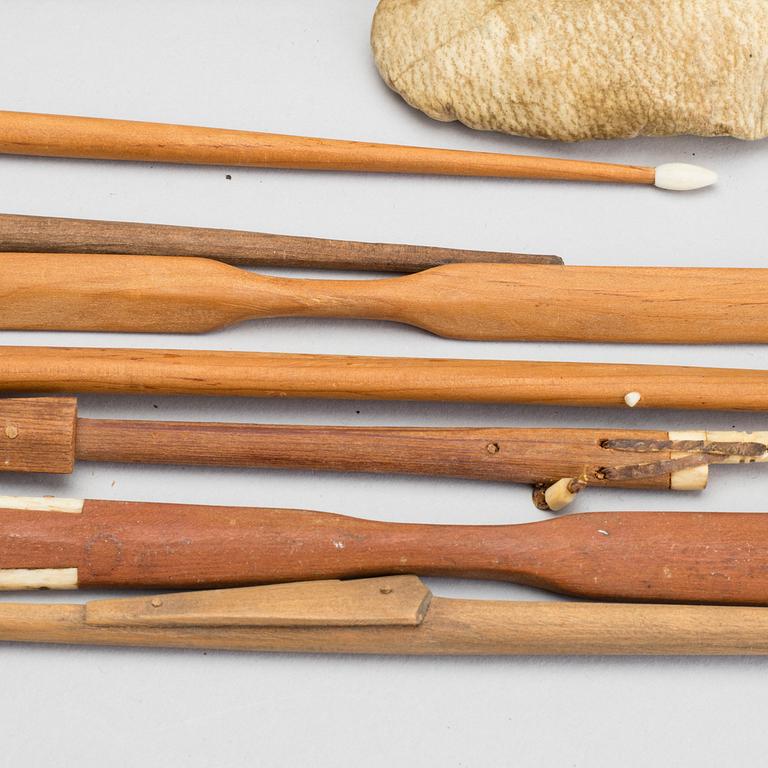 AN UMIAK AND THREE KAJAKS, MODEL BOATS GREENLAND, WITH FIGURES, PADDLES, SPEERS ETC.