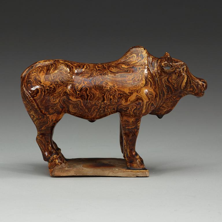 A marbled pottery figure of an ox, presumably Ming dynasty.