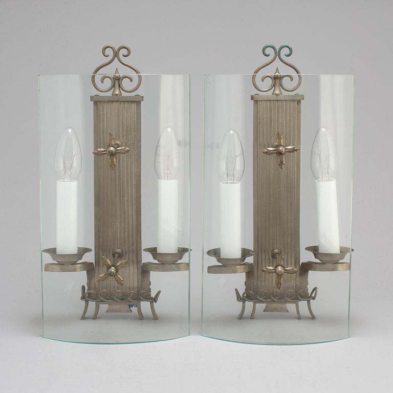 A pair of pewter wall lamps, 1920s.
