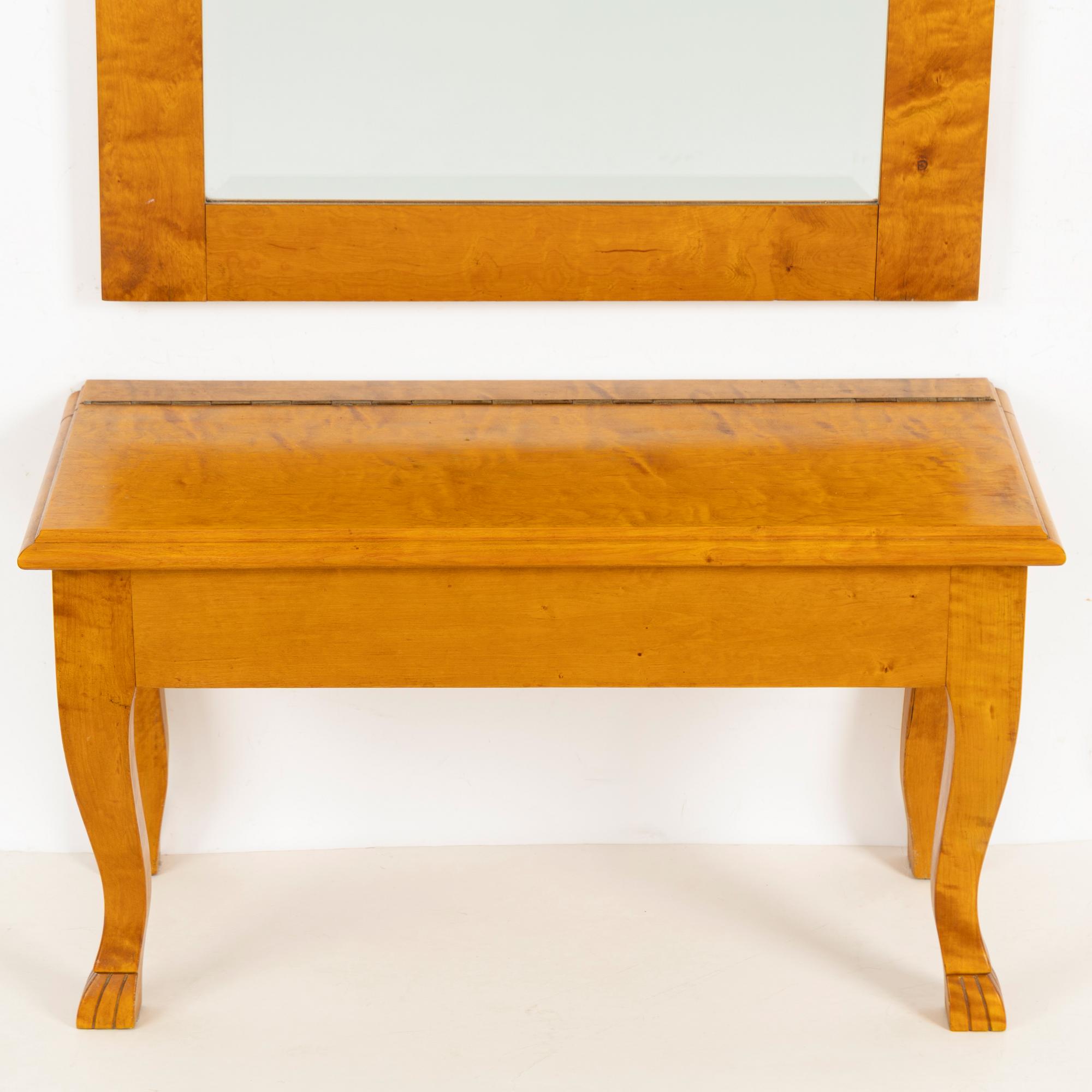 A mirror with console table, early 20th century.