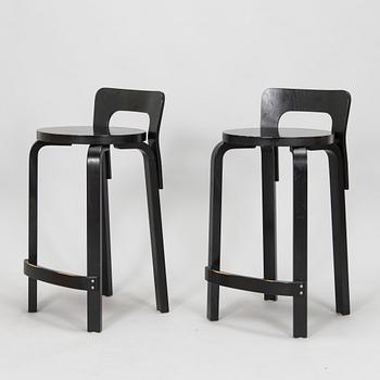 Alvar Aalto, a pair of model 'K65' bar stools for Artek, 2011.