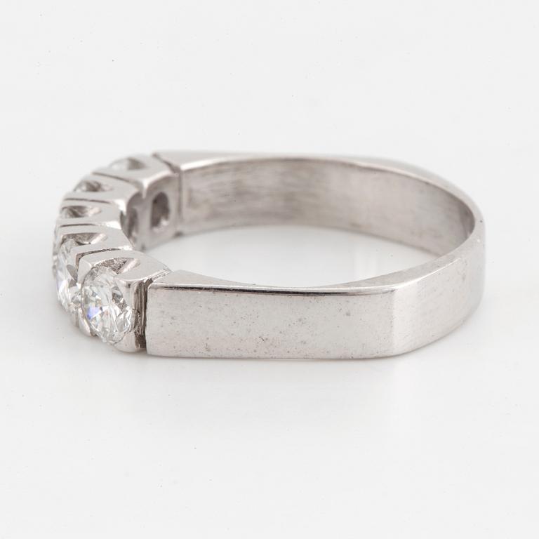 A half-eternity 18K white gold diamond ring.