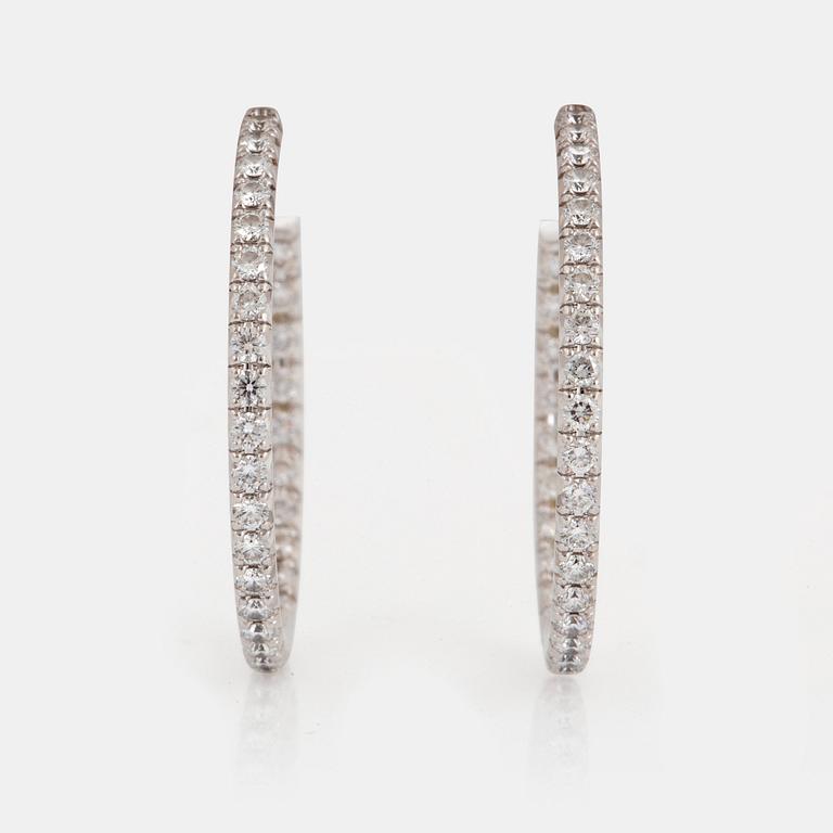A pair of Tiffany "Metro" 18K white gold hoops set with round brilliant-cut diamonds.
