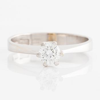 Ring solitaire with brilliant-cut diamond.