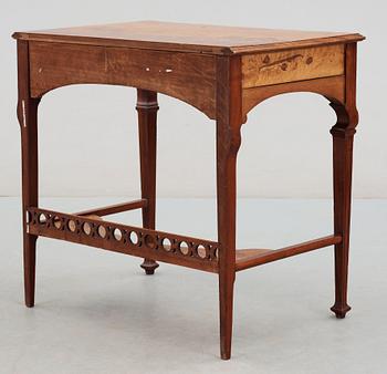 An Art Nouveau mahogany lady's desk with inlays of flowers in different kind of woods,