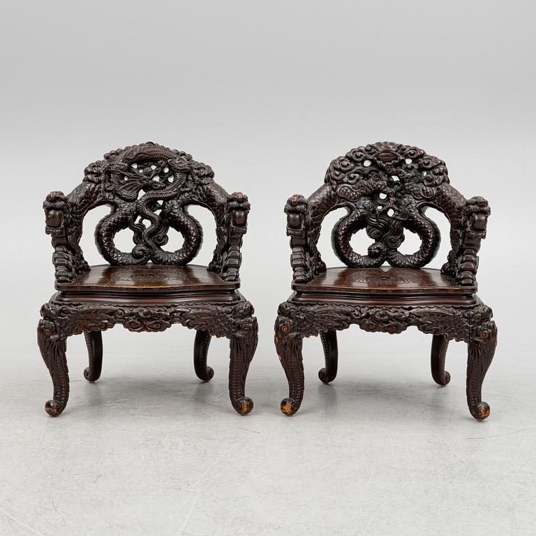 A pair of Chinese hardwood chairs, 20th century.