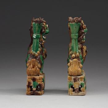 Two green, aubergine and yellow glazed bisquit joss stick holders, Qing dynasty, Kangxi (1662-1722).