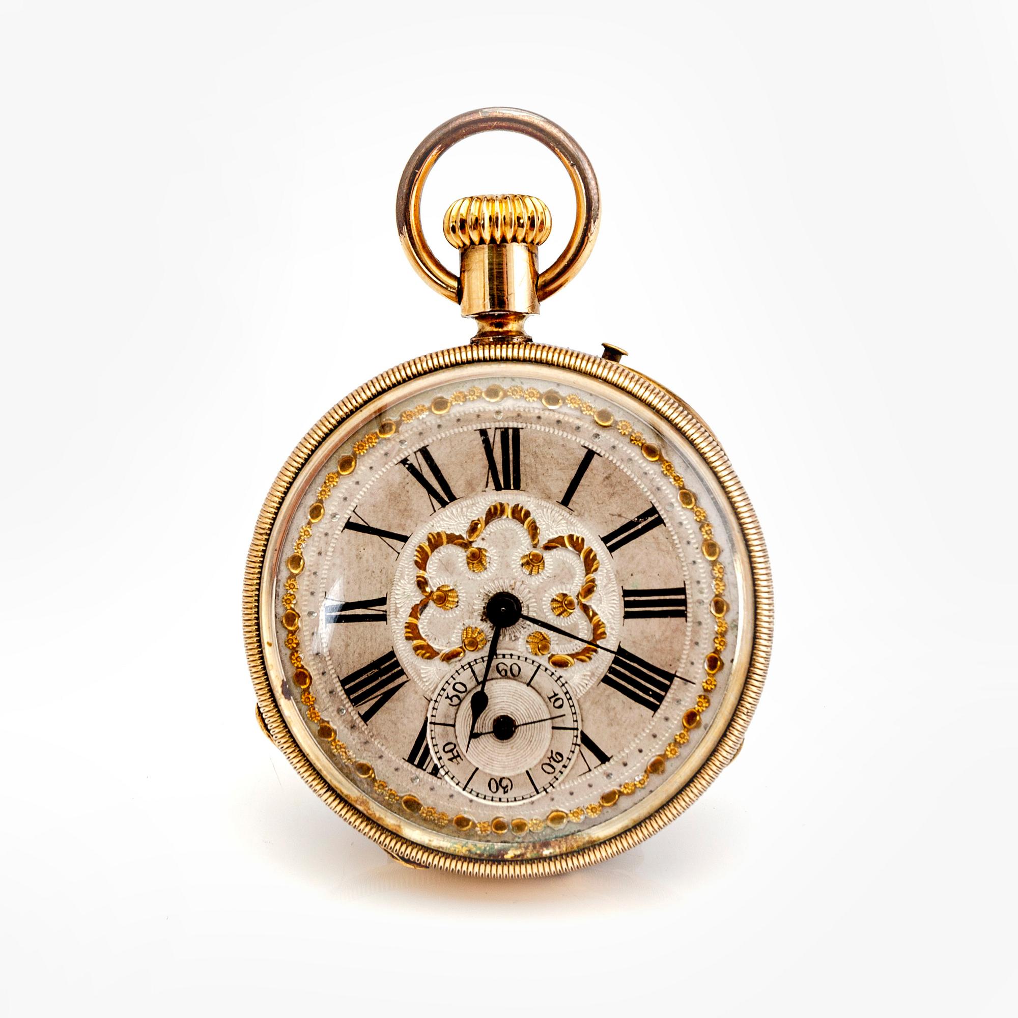 A mid 1800s gilded bronze pocket watch stand and pocket watch.