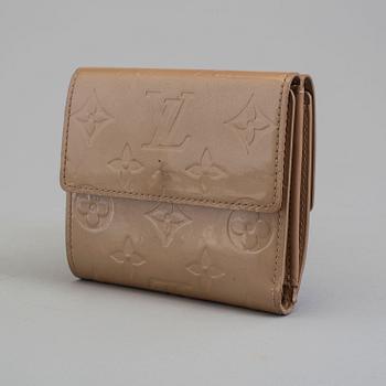 A beige monogram vernis wallet by Louis Vuitton.