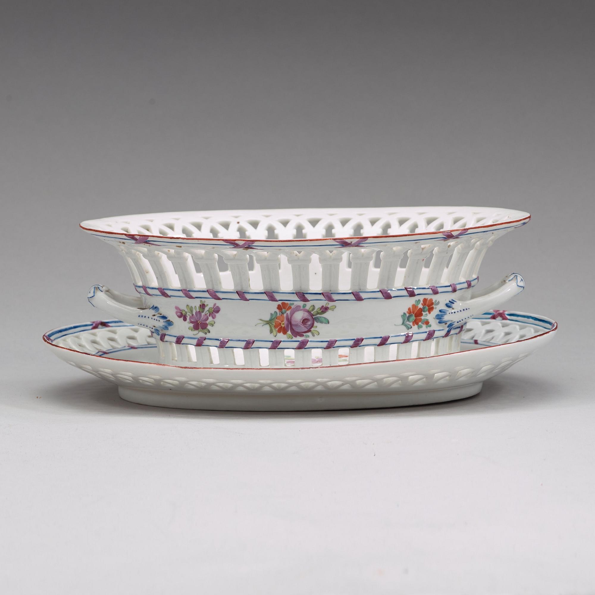 A Russian chesnut basket and stand, Imperial Porcelain Manufactory, St Petersburg, period of Alexander I (1801-25).