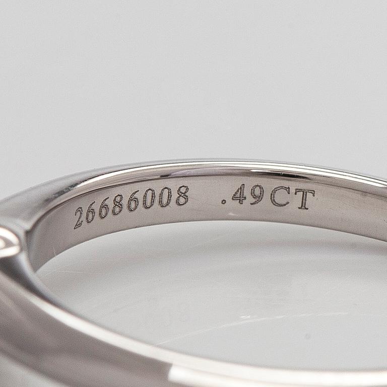 Tiffany & Co, a platinum solitaire ring with a brilliant-cut diamond.