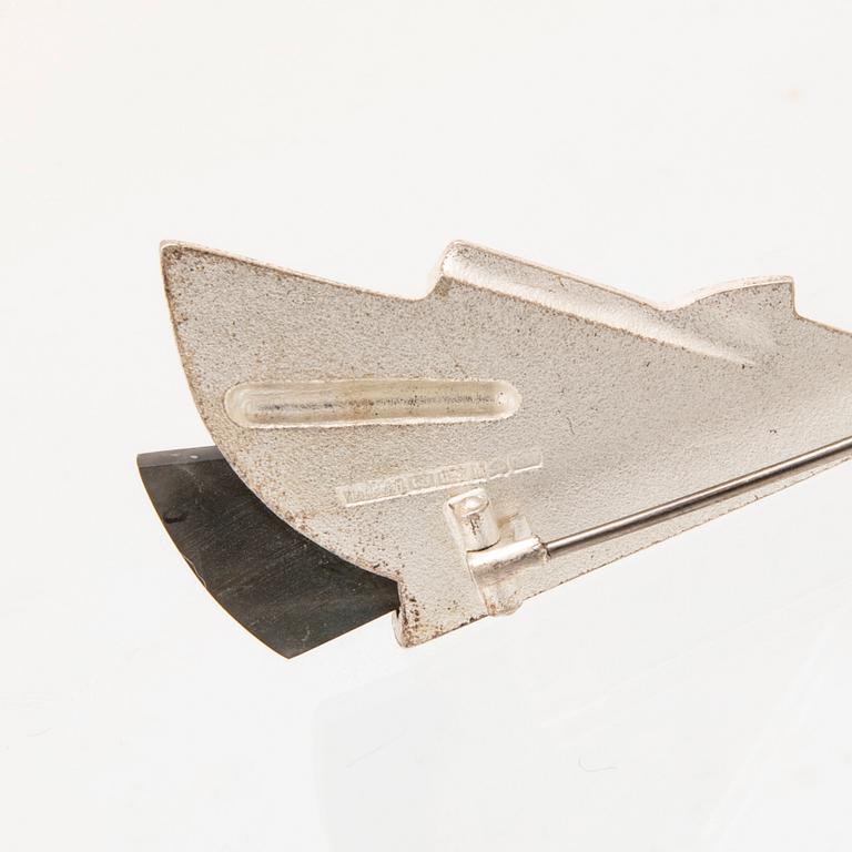 Zoltan Popovits, a "Railo" silver brooch set with spectrolite (variety of labradorite) for Lapponia 1991.